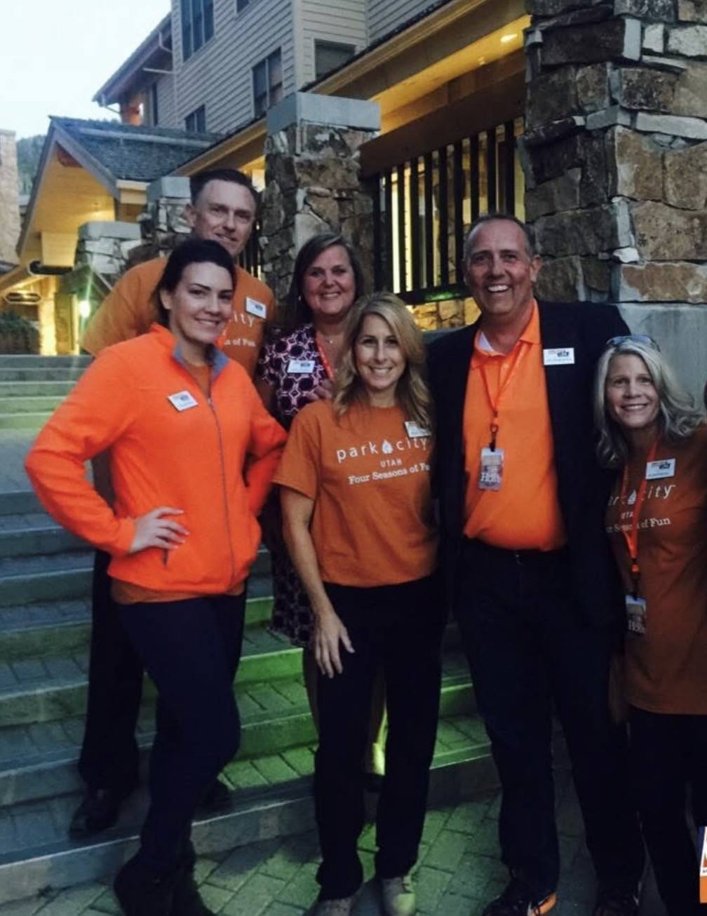 The Offsite Utah team gathered together on outdoor steps