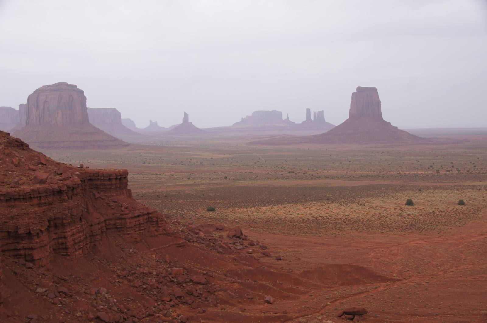 Monument Valley's iconic red rock buttes and mesas rising across the Southern Utah desert
